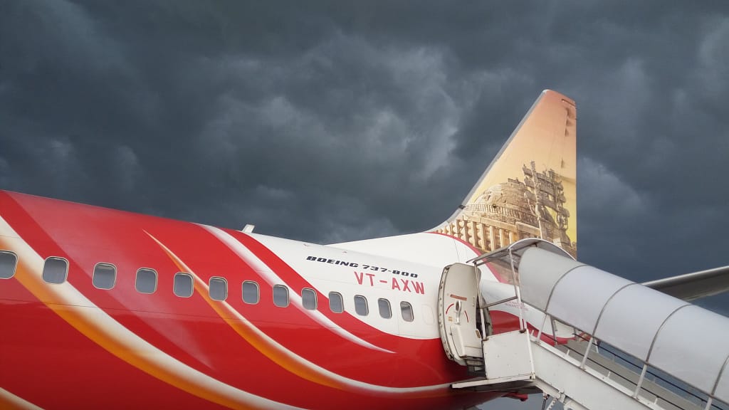 Air India Express Boeing 737 parked in bad weather