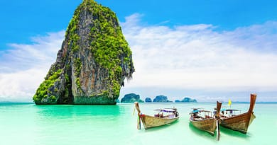 thai beach with boats