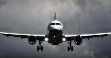 In Flight Airliner in Grayscale Photo